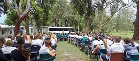 School assembly taking place outside
