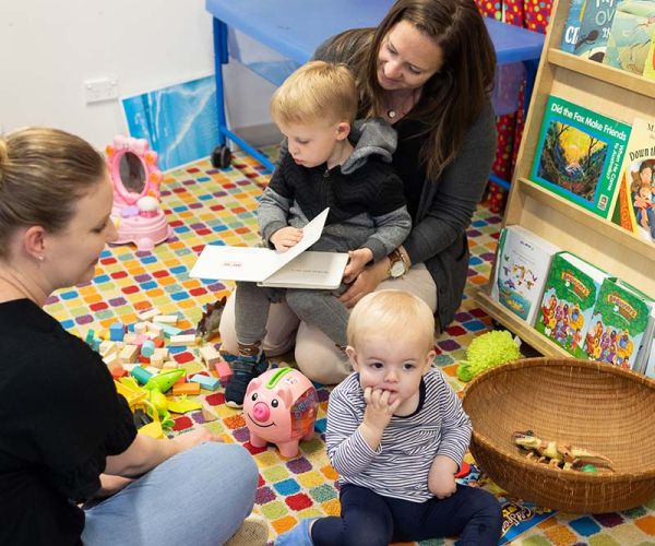 Mum and son reading a book