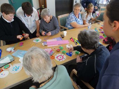 Students connecting with residents of a local retirement village